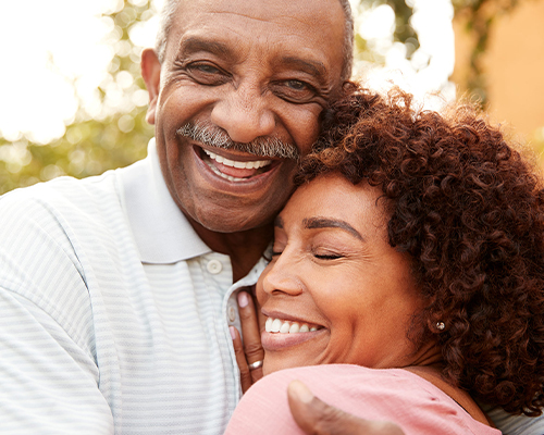 hugging seniors smiling annuity basics lifelong financial solutions