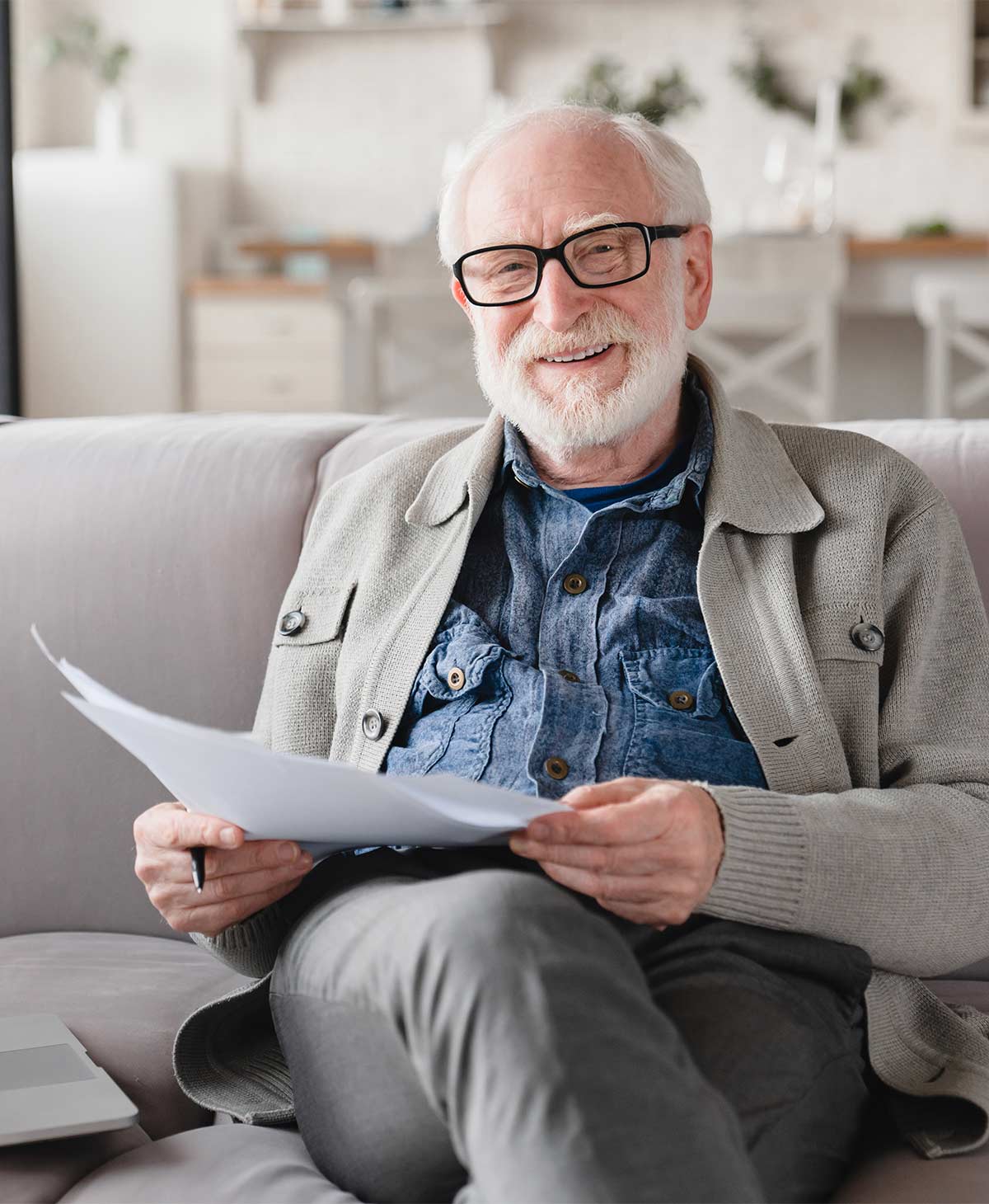 portrait of senior man reviewing financial paperwork what is a reasonable rate of return