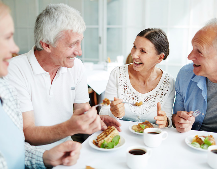 senior friends at restaurant safe options for retirement
